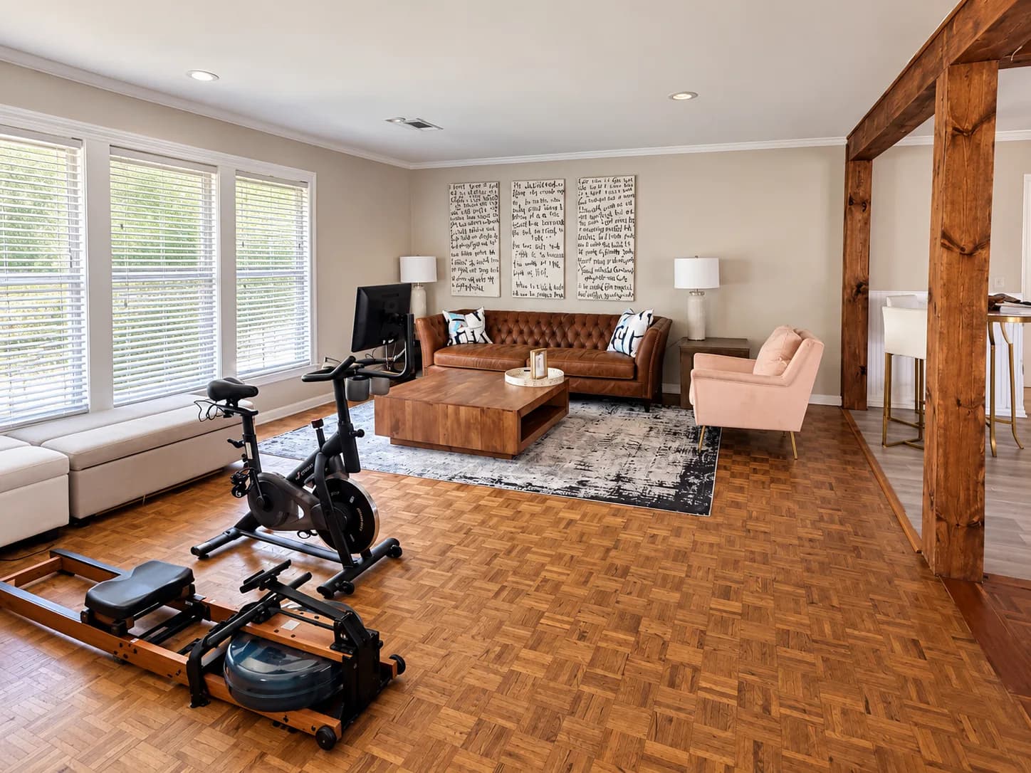 Den with exercise bike and rowing machine